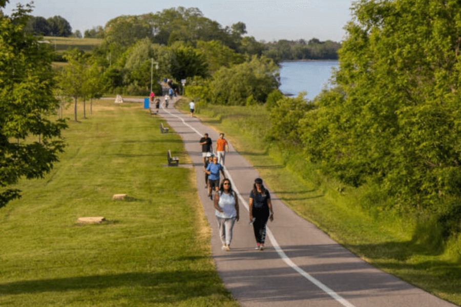 Folks taking a stroll down the Water Front Tail. Image courtesy of waterfronttrail.org