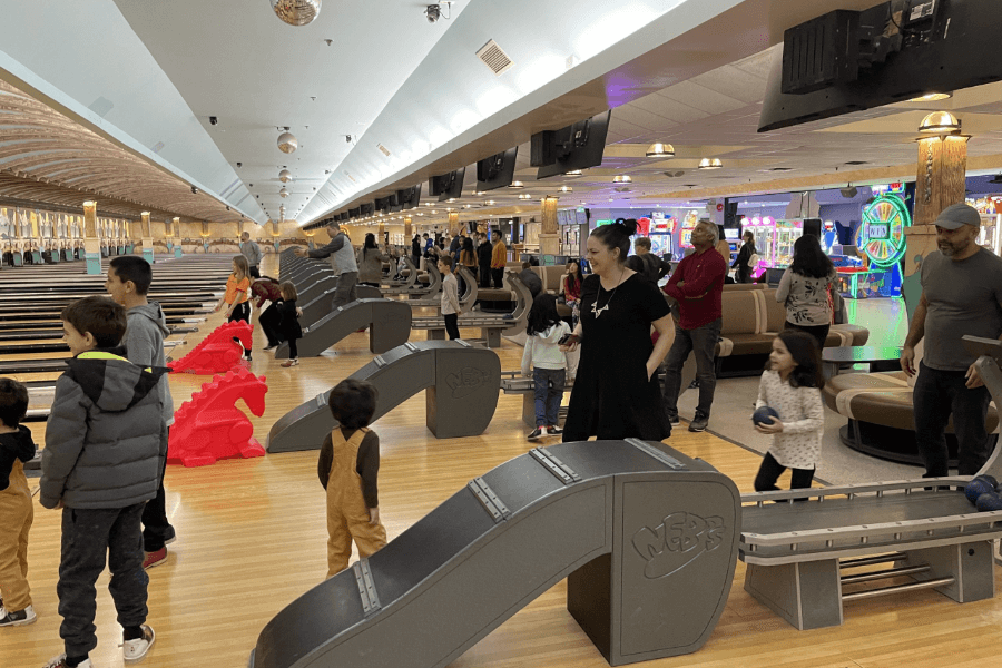 Bowlers of all ages are laughing and smiling among the lanes, excited to enjoy a game of bowling at NEB's Funworld. Image courtesy of opseu354.ca.